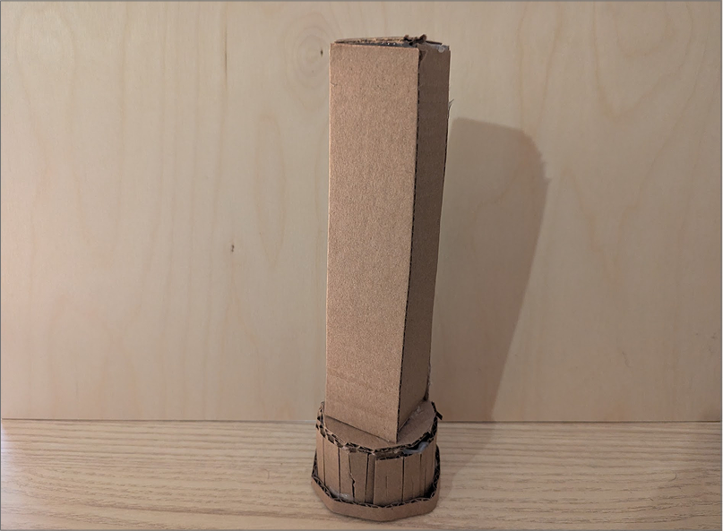 Photo of a lamp prototype. This prototype experimented with an angular shape and offers a tight fit at the base. Depending on the lights I choose, they could be positioned within the vertical light to show a powerful gradient.